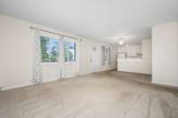 Open concept!  Numerous windows overlooking the common area.  A dining nook and full kitchen!