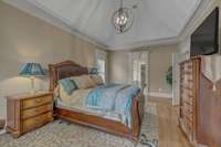 Spacious Primary Bedroom with hardwood and another awe-inspiring ceiling.