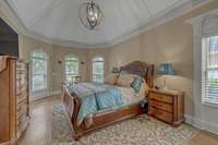 Look at the beauty in this shot: bay windows, tray ceiling, hardwood floors, and modern light fixtures. Your Primary Suite awaits!