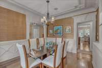 A view of the dining room with a charming tray ceiling.