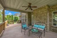 The covered deck is the perfect spot for savoring coffee, enjoying a meal, reading, or simply taking in the serene natural surroundings.