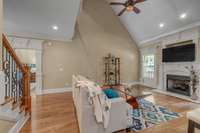 Relax by the fireplace and enjoy this lovely family room.