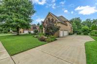 Lush landscaping with mature trees. Lots of parking spaces!