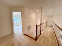 The door at the end of the walk-way is walk-in floored attic storage - lots of space!