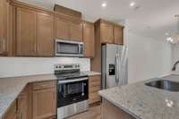 Stainless Steel appliances!  Comes w/a Move-In-Package that included the Refrigerator, Washer, Dryer and Blinds throughout!
