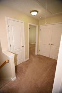 Hall with laundry facilities and linen closet