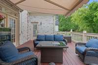 Porch off main floor great room with retractable awning