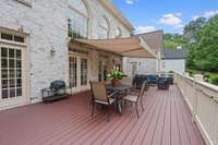 Porch off main floor great room with retractable awning
