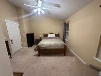 Primary bedroom at 13x14.  We could not show the secondary bedroom as it is currently in use by one of the sellers children & asked that we honor his privacy. it measures in at 10x14 & is quite spacious with an attached full bath & walk in closet