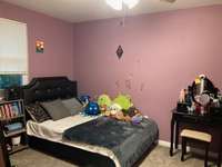 Bedroom located at the back corner on main level.