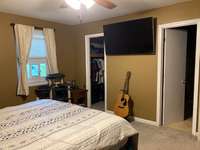 Large walk-in closet in primary bedroom.