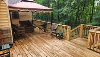 Newer  LARGE deck with canopy (to remain).  Plenty of space to gather and grill.