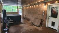 Door beside hot tub leads to driveway, door to right leads to 2-car basement garage.