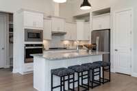 All interior photos are of a model home in another community.  Interior and exterior colors and features will be different.