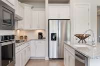 All interior photos are of a model home in another community.  Interior and exterior colors and features will be different.