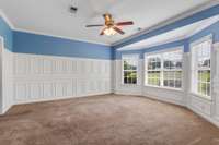 Primary bedroom - this is the real show stopper!  Massive bedroom with bay window overlooking the front greenery lawn.  This condo is located at the end of the cul-de-sac and if privacy is what you are seeking, this is the one.