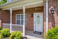 Cozy shaded Covered front porch
