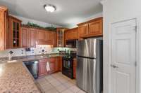 Large Pantry in kitchen as well as black and stainless appliances that all convey with the property.  The refrigerator is newer.