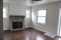Beautiful stone fireplace is the highlight of the living room.