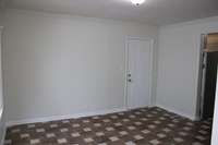 Large bonus room separate from kitchen and door leading to backyard.