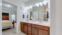 Spacious master suite with a full bath, walk-in closet, and convenient direct access to the laundry room.