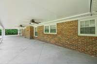Large Covered Patio with Ceiling Fans to Relax and Enjoy Your Private Backyard all year.