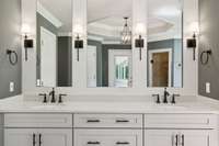 Beautiful Updated Cabinets, New Counter Tops, Mirrors, Faucets, and Lighting Fixtures.