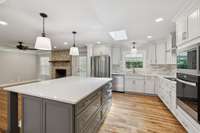New Cabinet Island with Updated Countertop and Lighting Fixtures.