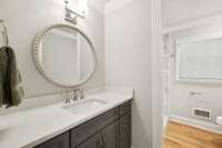 Updated Paint, New Mirror and Lighting in the Guest Bathroom.