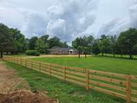 Brick Ranch House has an Absolutely Beautiful Setting for Peace and Privacy.  Fence is located on the adjoining Lot.