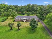 Beautiful Arial View of this Exquisite Brick Home.    New Grass was just sowed in the Yard around House.