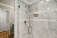 Beautiful New Full Tile Shower with Shower Door in the Guest Bath.