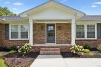 Updated Front Porch and Attractive Landscaping Welcome Your Family and Friends!