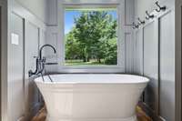 Large New Soaking Tub has an Updated Faucet and Lovely View of the Private Backyard.
