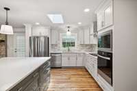 Kitchen is Open and Bright with Skylight!