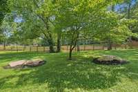 Mature Trees provide Shade in the Summer.  The Fence is located on the Adjoining Lot.