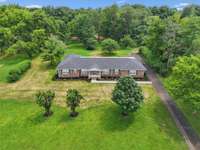 Beautiful Brick Home on Large 1.75 Acre Professionally Landscaped Lot!