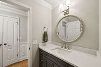 Hall Bathroom has New Vanity Cabinet, Counter Tops, Sink and Faucet.