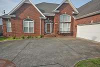 2 car side entrance garage with plenty of extra parking.