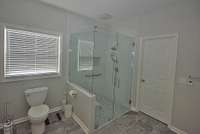 This is the primary bath. Very large and useful glass shower.