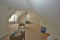 Enter into the bonus room upstairs. You can make two areas in here.