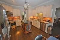 The kitchen is next to the living room. It comes with everything you need or want.