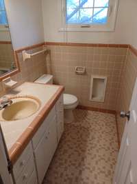 Half bath off kitchen and living room