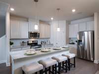 Photo is not of the actual home, but is an inspirational photo of builder’s model home and may depict options, furnishings, and/or decorator features that are not included