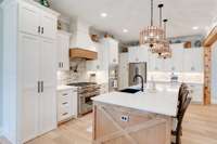 The well-appointed kitchen holds a few pleasant surprises, including a huge, hidden pantry, a pot-filler faucet over the gourmet gas range, and...