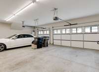 The spacious three-car garage has both beautiful and insulated doors.