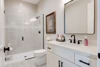 Modern, spacious and beautiful full guest bath.