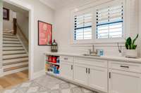 Notice that this wall with double window and custom shutters also has BEAUTIFUL TILE ALL THE WAY TO THE CEILING!
