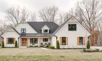 WELCOME to 1036 Wilderness Way - an exceptional custom home and 1.39 acres with gorgeous wooded views!
