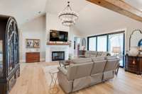 You'll enjoy this great room/living room from every angle.  The vaulted ceiling and gorgeous chandelier are dazzling, but the gas fireplace and wide open views of nature make it cozy and inviting - a place you'll never want to leave!